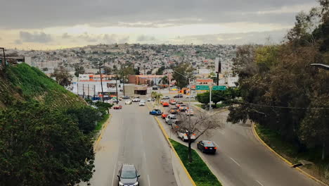 Cars-driving-on-busy-road-in-Tijuana,-Mexico