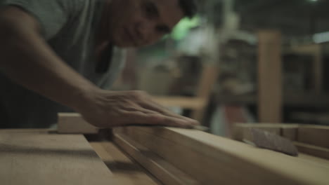 Carpenter-polishing-wood-using-sandpaper