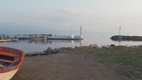 Harbor-pier-Greek-fishing-village-at-dusk-panning-slowly-wide-shot