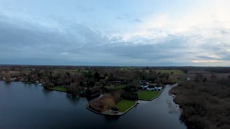 Aerial-footage-of-a-Norfolk-Broad,-the-Weir-in-South-Walsham