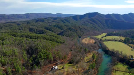 Drone-Shot-of-River-and-Mountains-Into-Forest