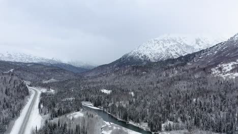 Aerial-view-rotaiting-around-Alaskan-river-and-trees