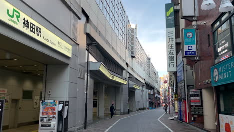 360º-panoramic-of-Kanda-Station-South-gate-of-with-people,-shops-and-vending-machine