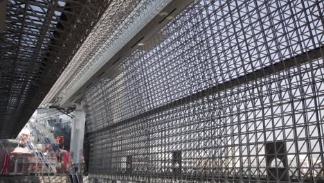 Slow-Pan-move-of-inside-of-Kyoto-Station-Building,-Kyoto,-Japan