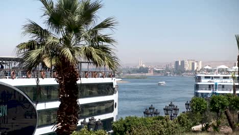 White-Cruise-liner-docked-in-Aswan-ready-to-sail-down-the-Nile-in-Egypt