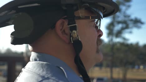 Firefighter-watches-and-listens-during-daily-briefing-at-a-fire-station-in-the-morning