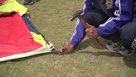 Tent-pitching-by-Himalayan-mountaineers-for-their-stay-in-upper-Himalayas-snowy-peaks