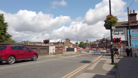 Level-Crossing-Barriers-Rising-Up-and-Cars-Beginning-to-Cross-in-Slow-Motion