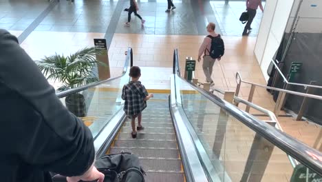 Arriving-passengers-heading-down-the-escalator-of-the-San-Diego-International-Airport-towards-the-Baggage-Claim-areas