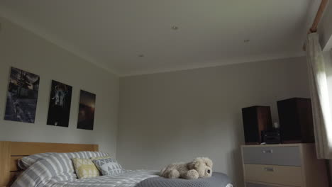 Downward-Tilt-Shot-of-a-Modern-Looking-Bedroom-in-a-Family-Home