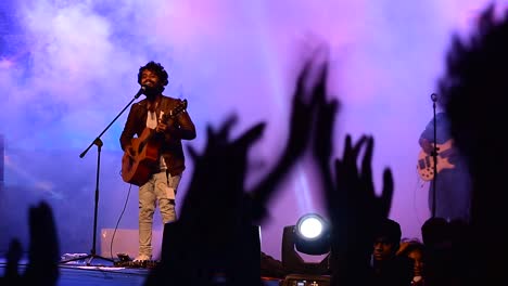 College-students-cheering-during-a-concert-in-their-college