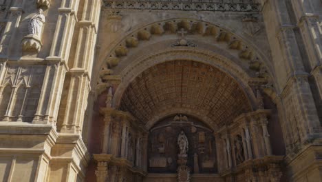 Pan-Up-From-Front-Gate-of-The-Cathedral-of-Santa-Maria-of-Palma-Revealing-Massive-Beautiful-Architecture