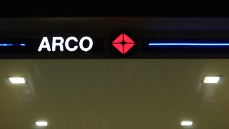 Pan-Down-from-Arco-Gas-Station-Sign-to-AMPM-Convenience-Store-Night