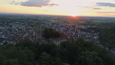 Panning-aerial-view-around-historic-castle-Strahlenburg-in-Schriesheim-Germany-during-beautiful-twilight