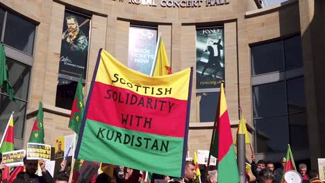 Slow-motion,-close-up-of-a-banner-saying-'Scottish-Solidarity-with-Kurdistan'