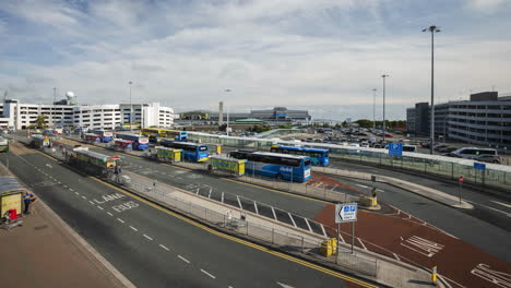 Time-Lapse-of-traffic-with-people-as-passengers-walking-at-Dublin-airport-flight-zone-terminal-in-Ireland