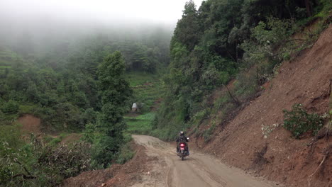 Kathmandu,-Nepal---September-27,-2019:-Traffic-and-vehicles-on-a-dangerous,-muddy-mountain-road-in-the-foothills-of-Kathmandu,-Nepal-on-September-27,-2019