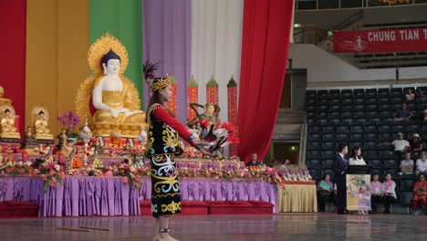 Indonesian-women-dancing-belly-dance-with-candle-holder-on-head-during-Buddha-Birthday-Festival,-Brisbane-2018