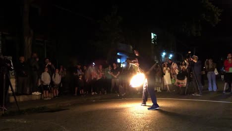 Swift-footed-Fire-Dancer-at-night,-Kensington-Market