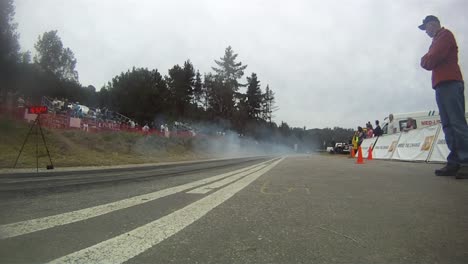 AC-Cobra-race-car-burns-oil-leaving-the-start-gate-in-African-race