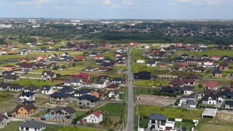 Aerial-View-of-Eastern-European-Neighborhood-With-Scattered-Houses-and-Fields