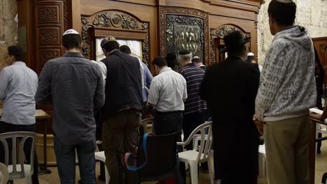 People-pray-to-the-Jerusalem-western-wall-inside-synagogue-view