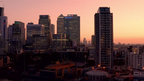 Aerial-view-of-London-Business-financial-district,-Canary-Wharf,-Isle-of-Dogs,-Canada-Square-with-an-awesome-sunset