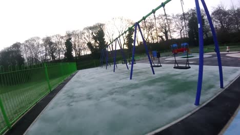Recreational-colourful-children's-spooky-empty-playground-FPV-slow-motion-flying-aerial-view