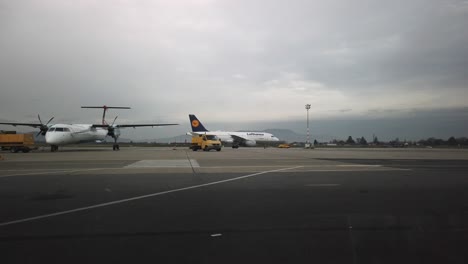 Arriving-Lufthansa-airplane-taxis-from-runway-to-airport-terminal