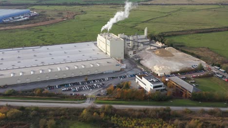 Wide-aerial-orbit-view-of-Knauf-plasterboard-factory-in-Kemsley,-UK