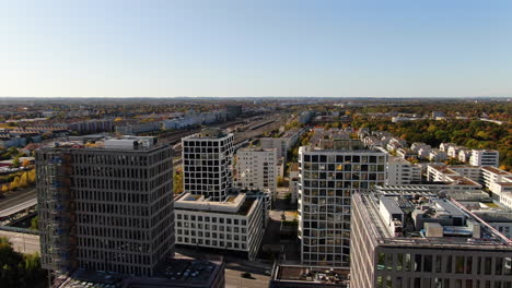 Aerial-drone-view-of-flying-above-office-buildings-in-business-district