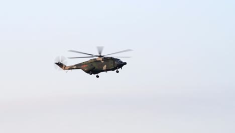 Chinese-People's-Liberation-Army-Z-20-Helicopter-from-Hong-Kong-Shek-Kong-Garrison-Base-in-Flight-under-Sunset-Sky