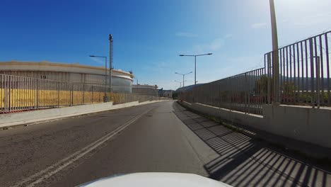 Driver-POV-passing-through-Hellenic-Petroleum-area-in-Attica-Greece