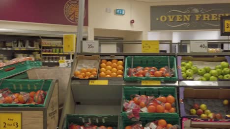 Slow-motion-interior-empty-UK-supermarket-passing-fruit-market-section