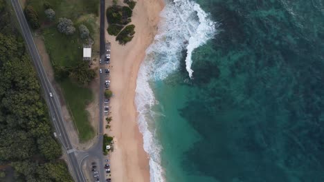Drone-flyover-of-sandy-beach-park-in-honolulu-hawaii