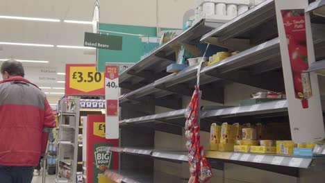 Restricted-supermarket-corona-virus-panic-buying-frightened-shoppers-store-shelves