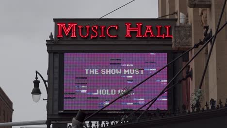 Electronic-marquee-on-Detroit-Music-Hall-says-the-show-must-hold-on