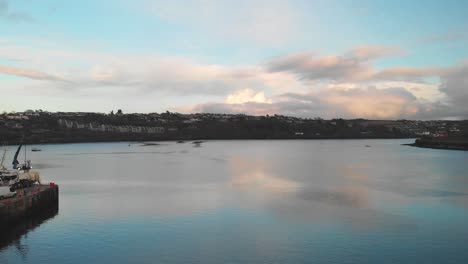 Clear-blue-sky-in-winter-evening-and-reflection-over-water-in-Kinsale-harbour