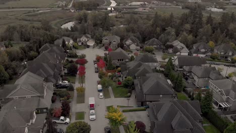 Drone-4K-Footage-Cloverdale-Urban-Housing-for-Middle-Class-Citizens-Zoned-City-Planning-at-Cul-de-Sac-with-truck-pulling-a-trailer