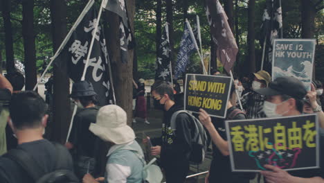 Demonstrators-In-Tokyo-With-Placards-And-Flags-Show-Their-Support-For-Hong-Kong-Protests---medium-shot