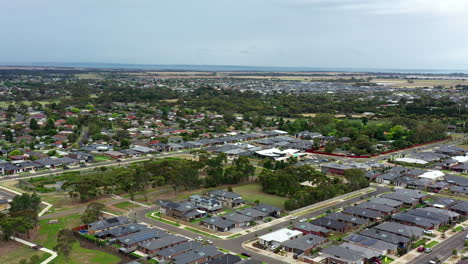 AERIAL-ARC-Town-Of-Lara,-Australia-And-Port-Phillip-Bay-In-Distance