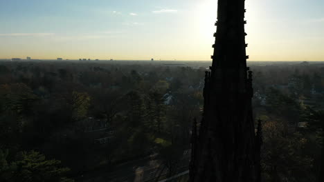An-aerial-shot-of-a-cathedral's-steeple,-which-was-taken-at-sunrise