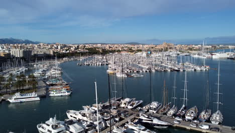 Aerial-over-Palma-de-Mallorca-marina,-cityscape-and-luxury-yachts