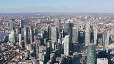 High-circling-drone-shot-of-Canary-wharf-Towers-on-a-sunny-day