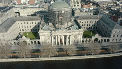Aerial-fly-away-shot-of-the-Four-Courts-to-reveal-the-city-skyline