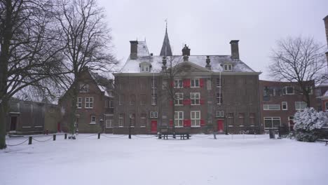 Leiden-Gravensteen-in-winter-snow,-pull-away-reveal-of-building