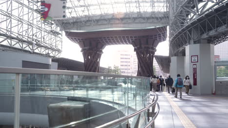 Commuters-With-Luggage-Walking-At-Kanazawa-Station-With-Tsuzumi-Gate-During-COVID-19-Pandemic-In-Japan