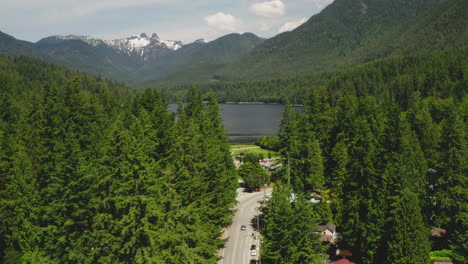 Aerial-drone-view-revealing-picturesque-Capilano-Lake-in-North-Vancouver,-British-Columbia