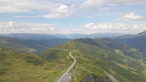 Beautiful-aerial-shot-flying-over-a-mountain-range-and-valley-in-Norway