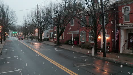 Winter-snow-flurries,-snowflakes-in-winter-town-scene-in-USA